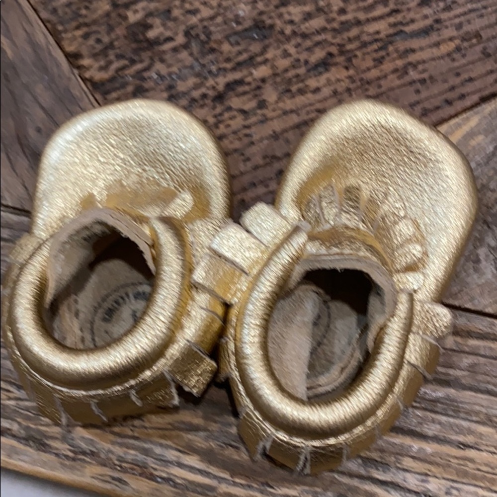 Baby girl freshly picked Moccasins gold